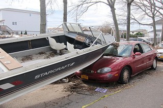 boat smashes into parked car